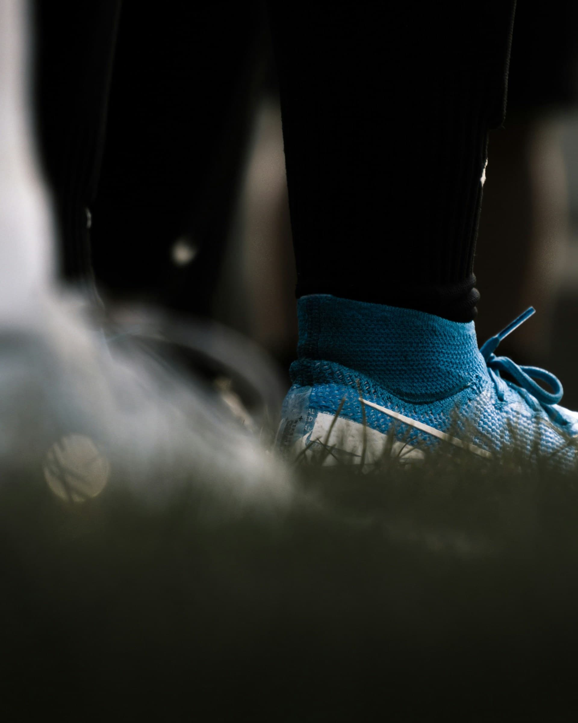 Young football player training on a club pitch